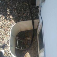 Sump pump draining into a window well