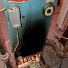 Unsafe boiler exhausting into house